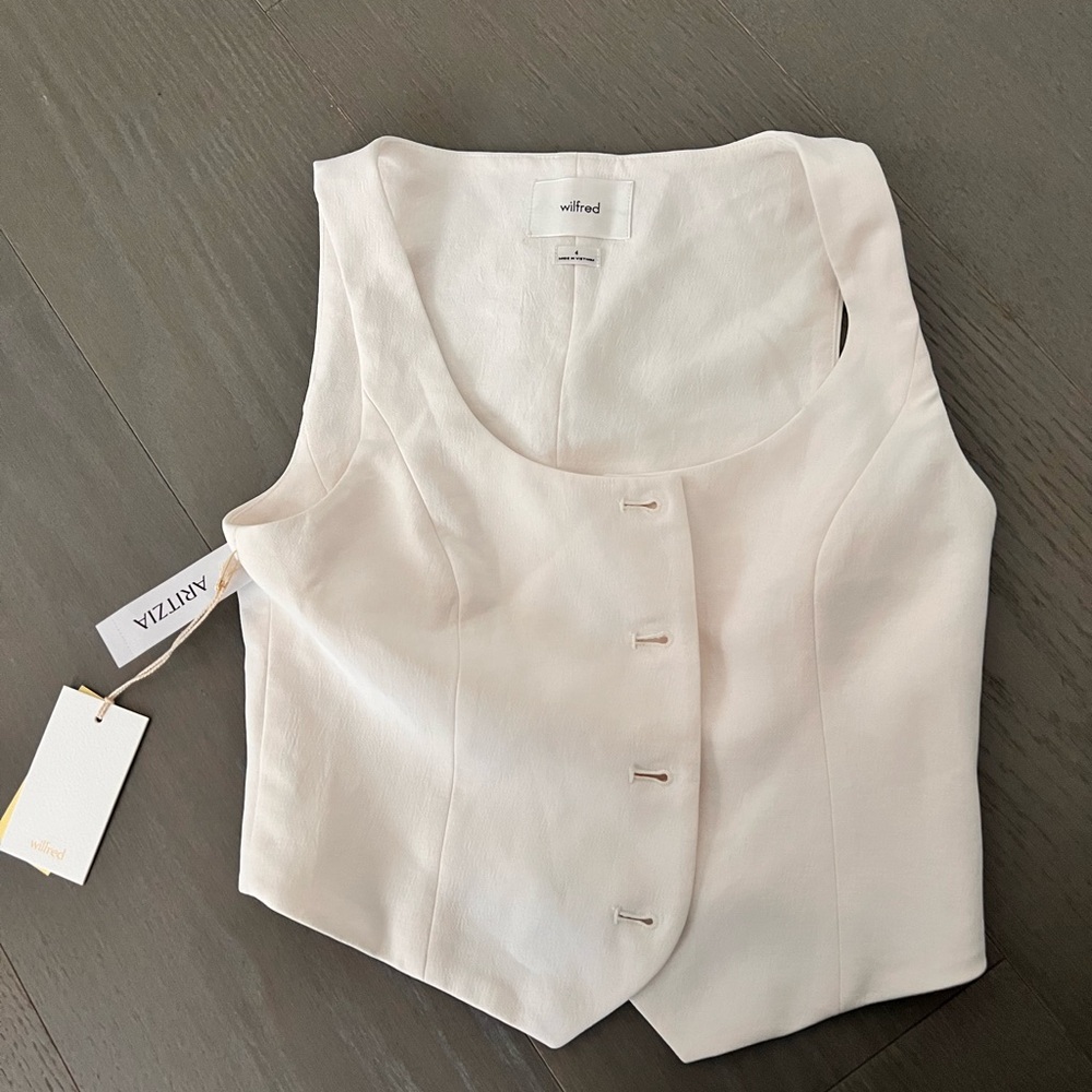 This is a classic button-up vest with princess seams for shaping